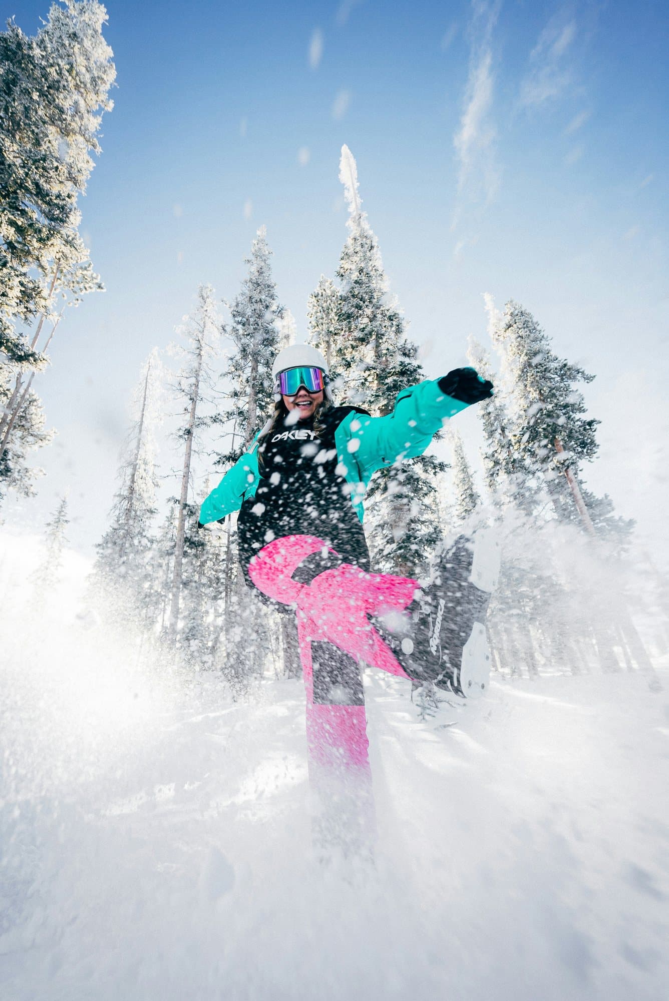 Snowboarder dropping into deep powder